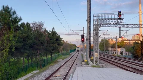 The train arrives at the platform twilight - stock video Stock Footage 240342872