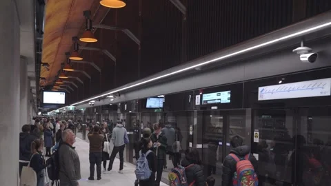 Train Arrives at State Library Station, Passengers Disembark Stock Footage 322076081