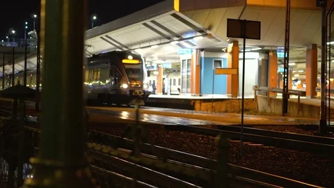 Train arrives at the station at night Stock Footage 81417567