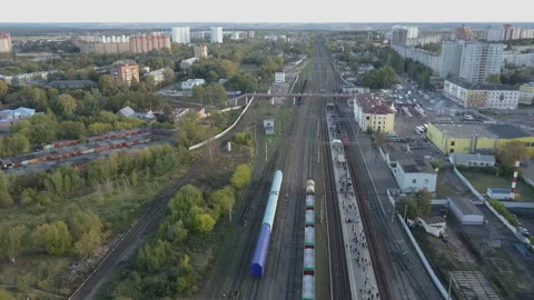 The train arrives at the station. A platform on which people wait for the train. Stock Footage 145932949