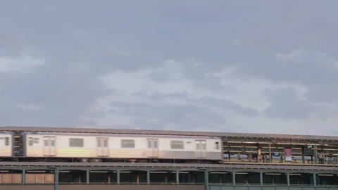 A train arrives at the station in Queens Stock Footage 278247828