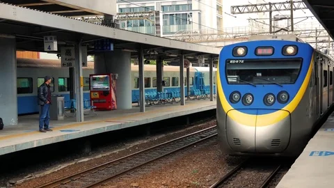 Train arriving at Kaohsiung Station Stock Footage