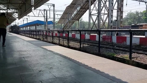 Train arriving on platform, Indian railways and local station platform mumbai Stock Footage 240553573