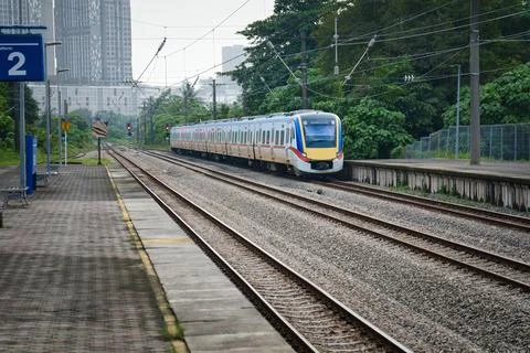 Train arriving at a platform. Stock Photos