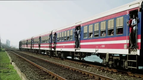 Train arriving to Railroad on the sea beach Stock Footage 47010835