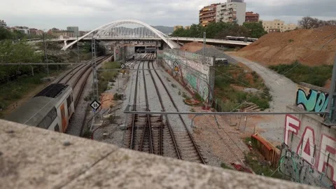 Train Arriving at Station under Calatrava's Bridge in Barcelona 1st  May 2022 Stock Footage 193674310