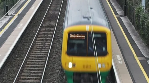Train arriving at train station Stock Footage 57682665