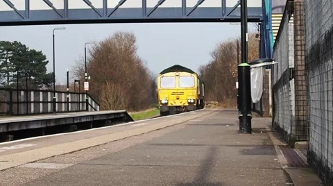 Train arriving at train station Stock Footage 57682744