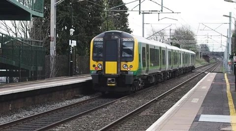 Train arriving at train station Stock Footage 57686522