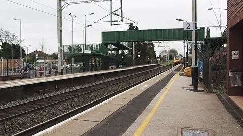 Train arriving at train station Stock Footage 57686953