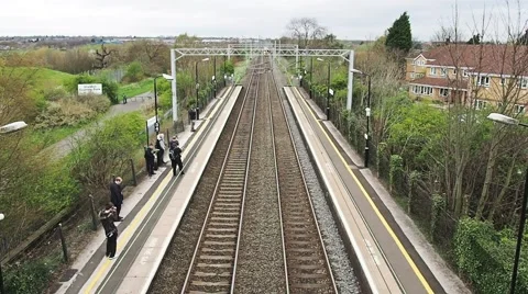 Train arriving at train station Stock Footage 57691568