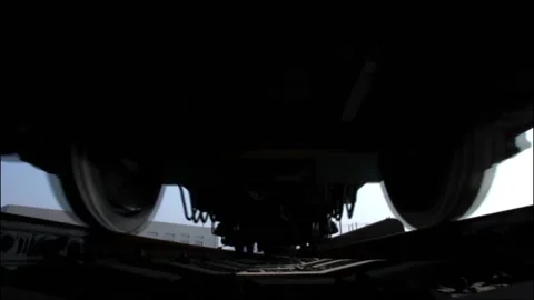 Train bottom under view close-up.Bottom View of a Going Train and rails. Stock Footage 132187068
