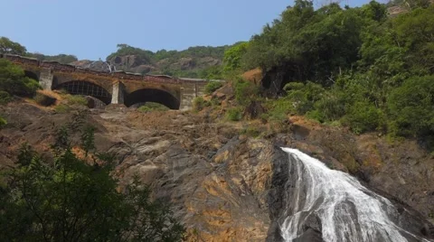 Train on bridge above Mangali waterfall Stock-Footage 43858287