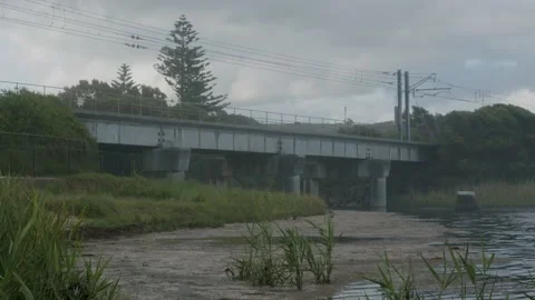 Train bridge across a beach river 4K Stock Footage 167926603