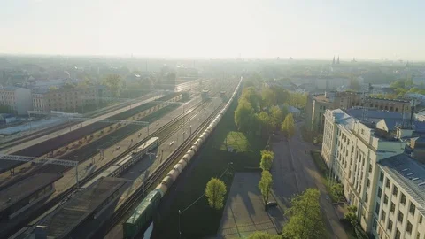 Train bridge and rail roads with train in Riga City Slowmotion drone Flight near Stock Footage 91287306