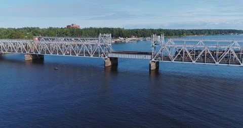 Train Bridge drone flightabove Lielupe river Jurmala city , green nature, ship Stock Footage 88834273
