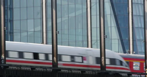 Train on the bridge in front of skyscraper Video stock 53286909