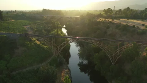 Train bridge at the Maule river in Chile Stock Footage 235636594