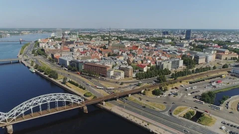 Train bridge in Old Riga City rail roads Slowmotion drone Flight near bridge Stock Footage 91278071