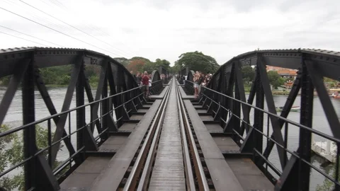 Train on the bridge over the river Kwai in Kanchanaburi, Thailand Stock Footage 102660023