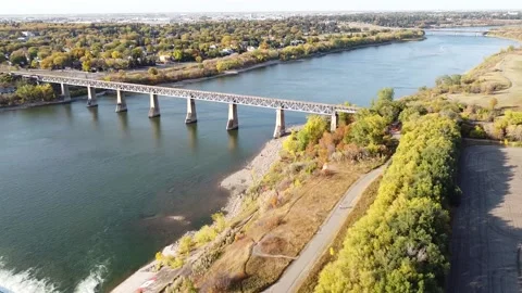 Train Bridge Over River in Saskatoon Stock Footage 140975117