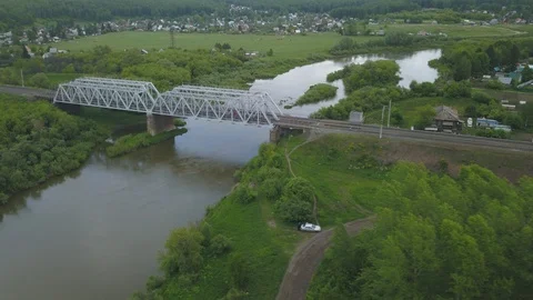 Train bridge over small river in Siberia, Russia. Hyper lapse aerial view. Stock Footage 110296958