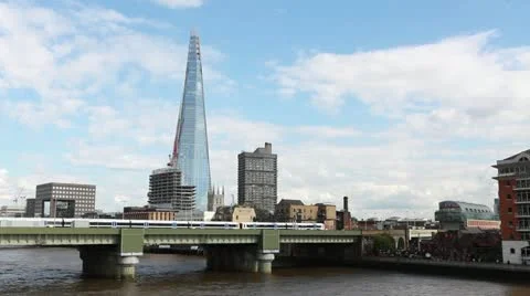 Train on bridge with The Shard London Stock Footage 12393579