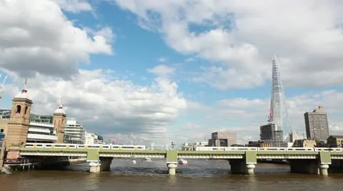 Train on bridge with The Shard London Stock Footage 12394599