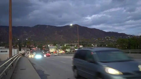 Train Bridge with Sunset Traffic - Glendale, CA 02 Stock Footage 196251596