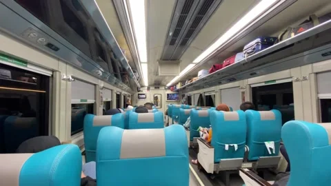 Train car vibes with seating interior and passengers at night 스톡 동영상 347543543