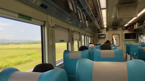 Train car vibes with seating interior and passengers Stockbeeldmateriaal 347543559