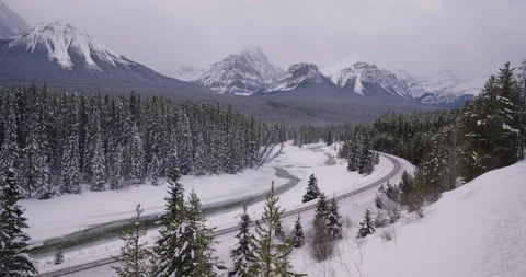 Train cargo winter landscape Rocky Mountains Lake Louise Banff National Park 4k Video stock 151364161