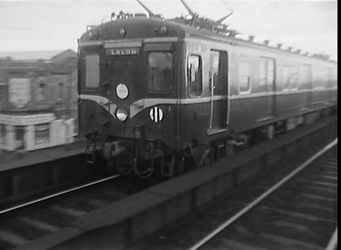 TRAIN CARRIAGES LEAVING STATION, MELBOURNE, AUSTRALIA (1969) Stock Footage 168656350