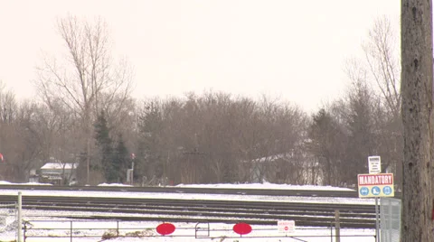 Train Carrying Cargo Moving on Snowy Tracks HD Video Stock Footage 30770146