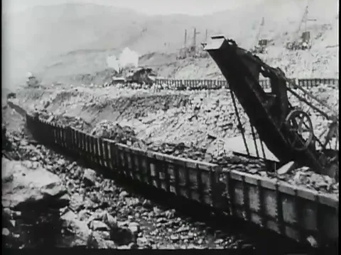 Train carrying material load passing and leaving through rail road - 1900 Stock Footage 108625939