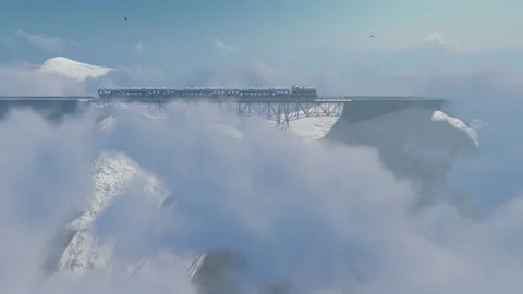 Train in the clouds above mountains with snow and cold weather Video stock 165205901