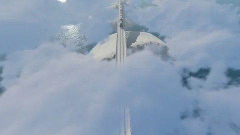 Train in the clouds above the mountains, winter time, top view  Stock Footage 162247940