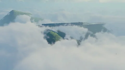 Train in the clouds, railway above mountains Stock Footage 157965187