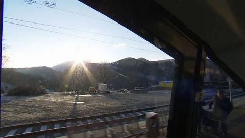 Train comes to a halt in station of a small town Video stock 71297760