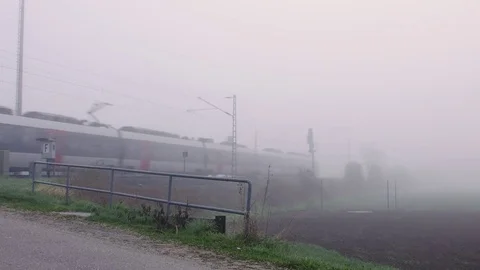 A train comes out of the mist Видео 74522554