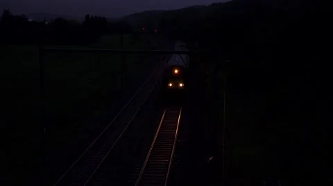 Train coming fast in the night 4k Stock Footage 46213592