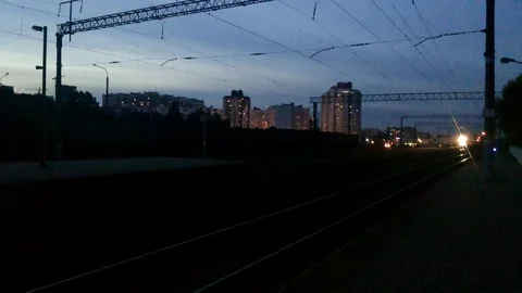 Train coming to the station in the evening twilight Stock Footage 95245903
