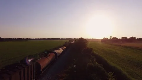 Train coming from the sunset Stock Footage 82321105