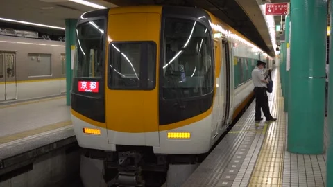Train Conductor and Train Parked at Station in Nara, Japan Stock Footage 264344538