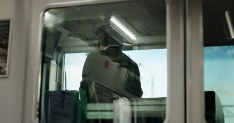 Train, conductor and window or transportation for travel Japan, control room or Stock Footage 261011127