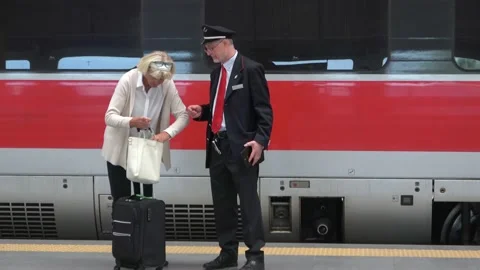 Train Conductor Checks Ticket In Rome, Italy Stock Footage 154970782