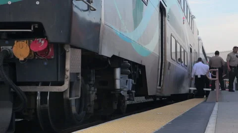 Train conductors and security next to amtrak metrolink train Stock Footage 61095839
