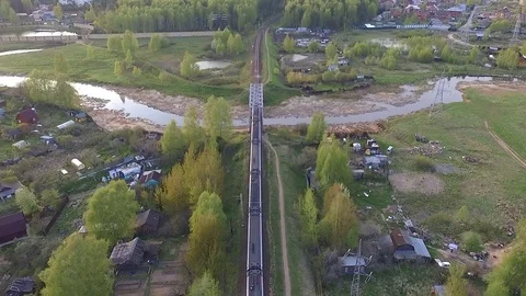 Train crosses the river driving over the bridge Stock Footage 75656823