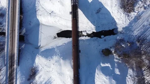 The train crosses the river over the bridge Stock Footage 157578882