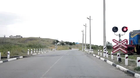 The train crosses the road. blinking red semaphore Stock Footage 54928415
